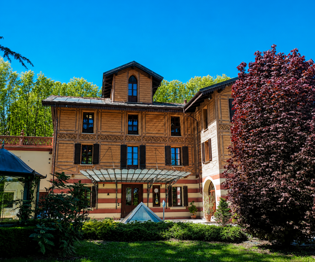 La facciata principale di Villa La Sorridente, sede di Infor Elea, circondata dal verde delle colline pinerolesi.